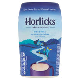 The Horlicks - Original Hot Malted Drink - 270g container, adorned in blue with a countryside illustration, features a steaming cup of the beverage. The packaging highlights its creamy and delicious taste while emphasizing nutritional benefits such as calcium, zinc, and vitamins C, D, and B12.